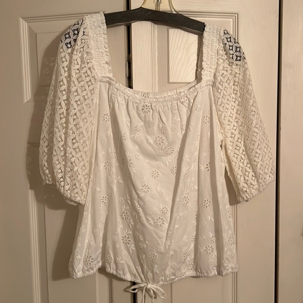 Large white with lace sleeves 3/4 length sleeves.